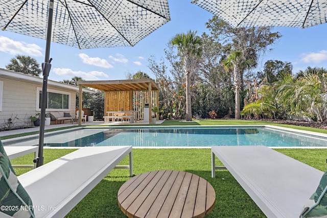 view of pool featuring a yard