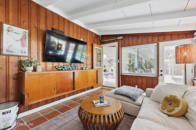 tiled living room with beamed ceiling and wooden walls