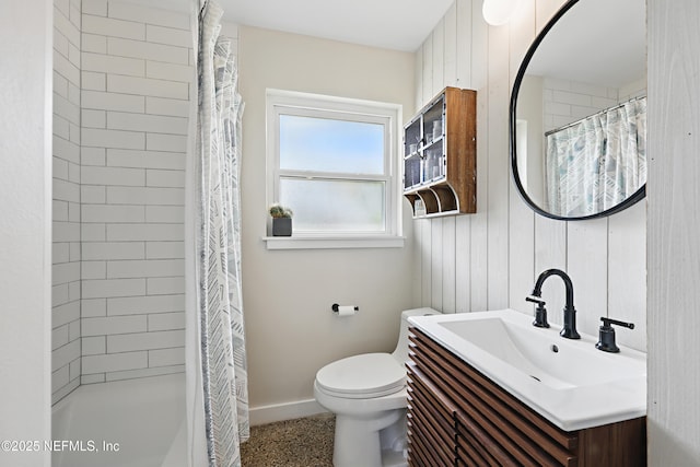 bathroom featuring vanity, a shower with shower curtain, and toilet