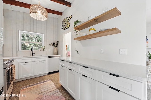 kitchen featuring dishwashing machine, sink, stainless steel range with electric stovetop, hanging light fixtures, and white cabinets