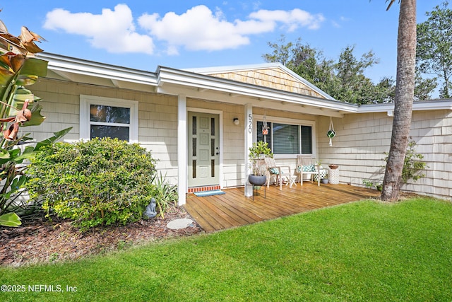 view of front of home with a front yard and a porch