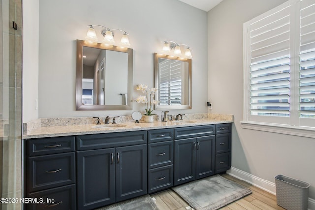 bathroom featuring hardwood / wood-style flooring and vanity