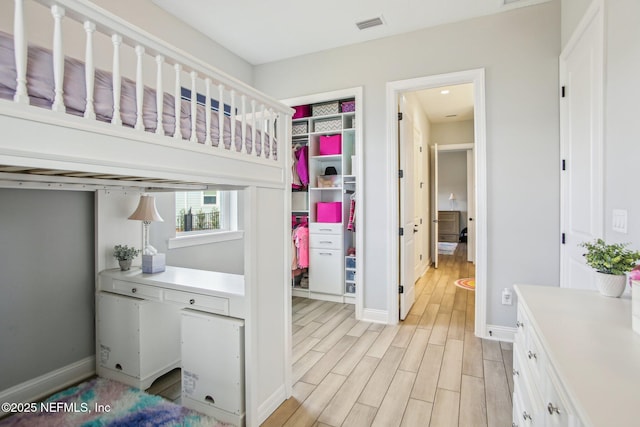 bedroom with light hardwood / wood-style flooring