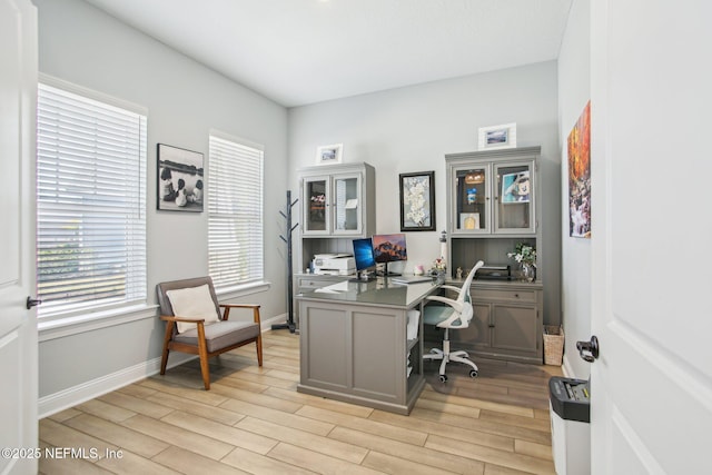 office with light hardwood / wood-style floors