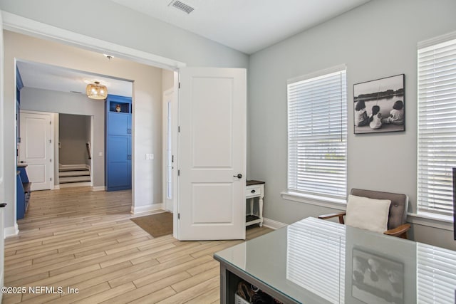 home office with light wood-type flooring