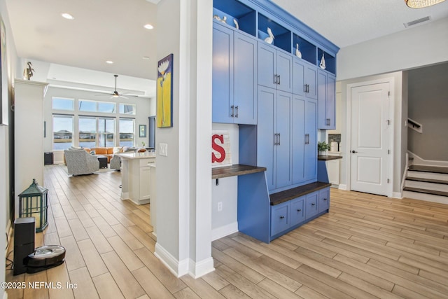 mudroom featuring light hardwood / wood-style floors and ceiling fan