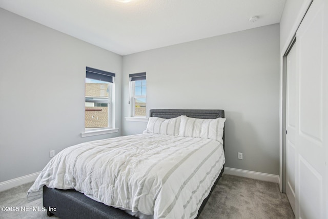 bedroom with carpet and a closet