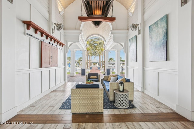 interior space featuring decorative columns and vaulted ceiling