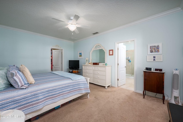 carpeted bedroom featuring crown molding, ceiling fan, ensuite bathroom, and a textured ceiling