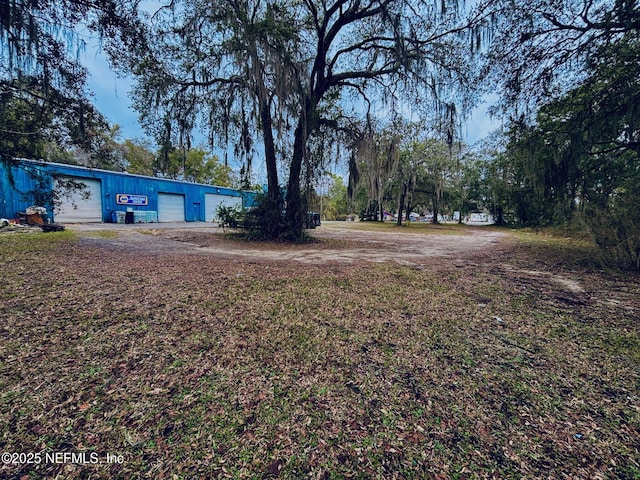 view of yard with a garage