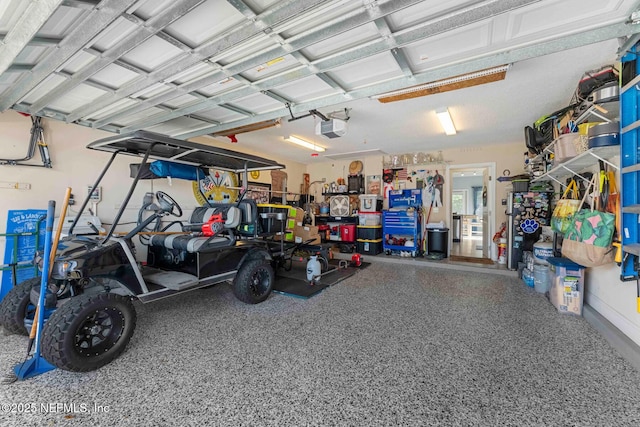 garage featuring a garage door opener