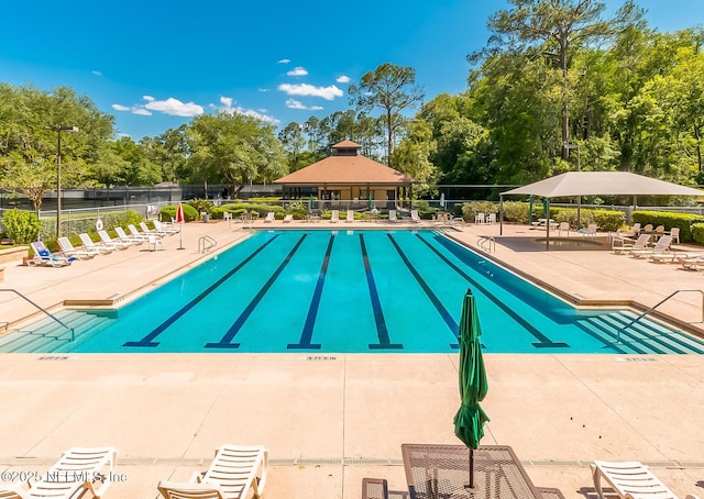 view of swimming pool with a patio area