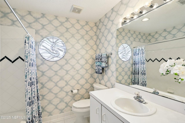 bathroom with visible vents, toilet, a shower with shower curtain, vanity, and wallpapered walls