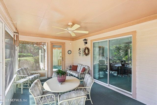 sunroom / solarium with ceiling fan