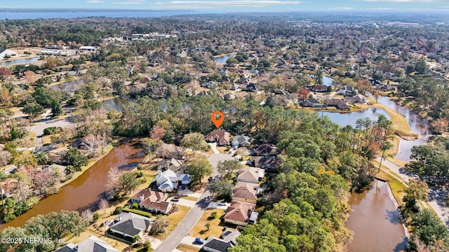 drone / aerial view with a residential view and a water view