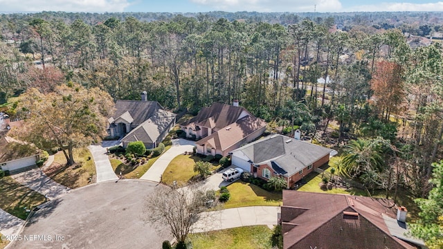 bird's eye view featuring a wooded view