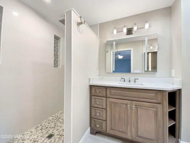 bathroom featuring vanity and a shower