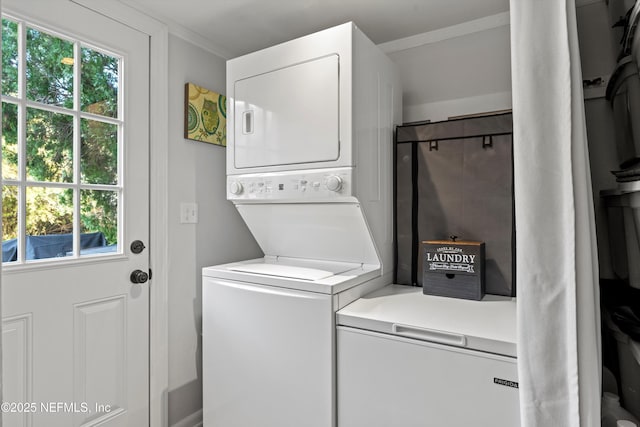 washroom with stacked washer / dryer