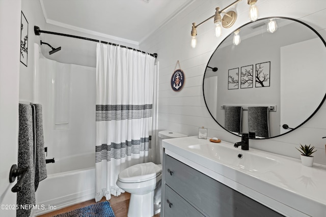 full bathroom featuring hardwood / wood-style floors, vanity, ornamental molding, shower / bath combination with curtain, and toilet