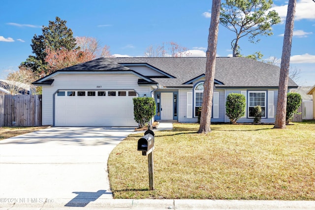 ranch-style house featuring a garage and a front lawn