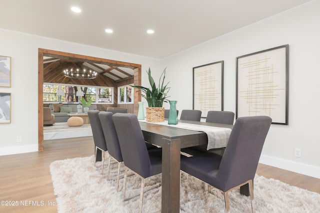 dining space featuring crown molding and wood-type flooring