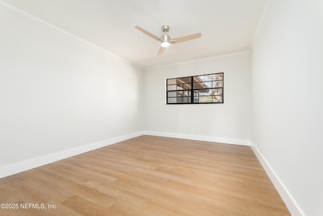 empty room with ceiling fan, ornamental molding, and light wood-type flooring