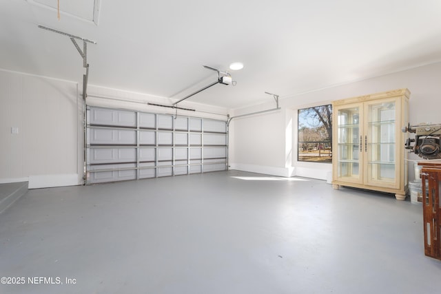 garage with french doors and a garage door opener