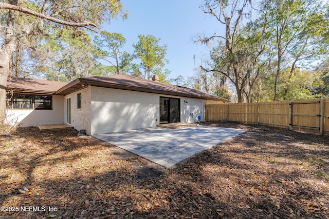 rear view of house featuring a patio area