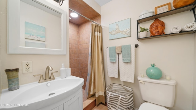 bathroom with a shower with shower curtain, toilet, and sink