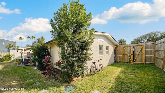 view of side of home featuring a yard