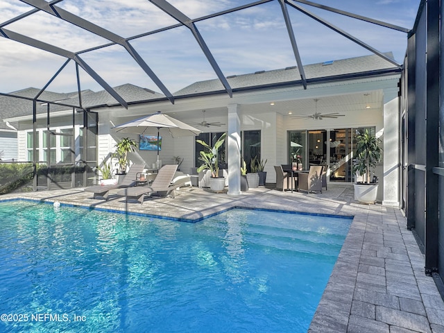 view of pool featuring a lanai, ceiling fan, and a patio area