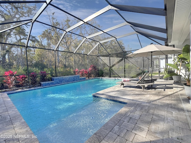 view of pool featuring a lanai and a patio area