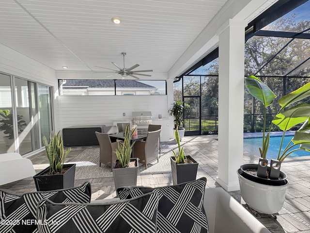 sunroom with plenty of natural light and ceiling fan