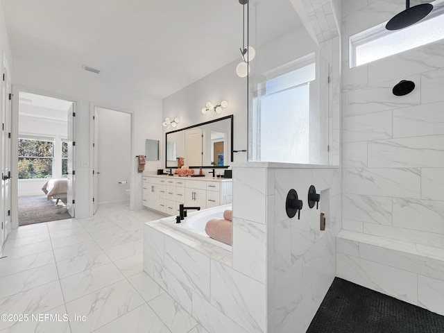 bathroom featuring shower with separate bathtub and vanity