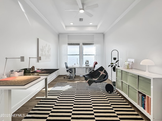 home office with a raised ceiling, ornamental molding, dark hardwood / wood-style flooring, and ceiling fan