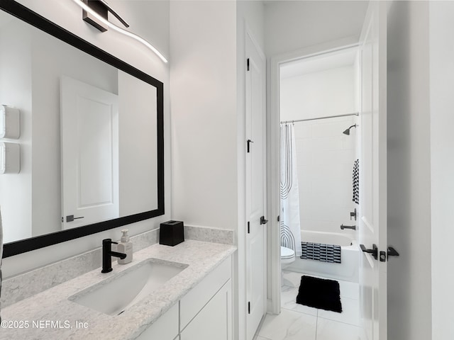 full bathroom with vanity, shower / tub combo, and toilet