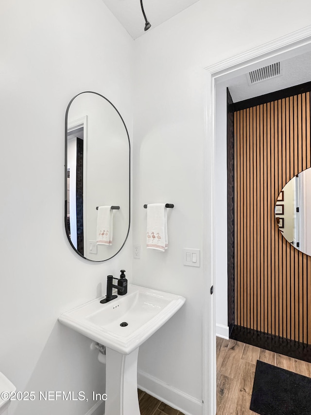 bathroom featuring hardwood / wood-style flooring