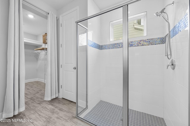 bathroom featuring wood-type flooring and walk in shower