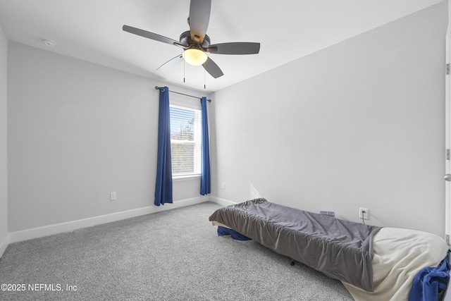 bedroom with ceiling fan and carpet flooring