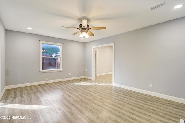 unfurnished room featuring ceiling fan and light hardwood / wood-style floors