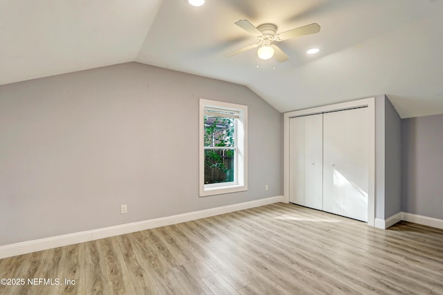 additional living space featuring vaulted ceiling, ceiling fan, and light hardwood / wood-style floors