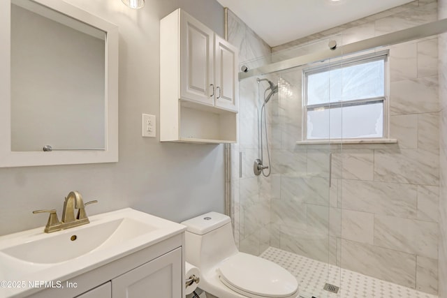 bathroom with walk in shower, vanity, and toilet