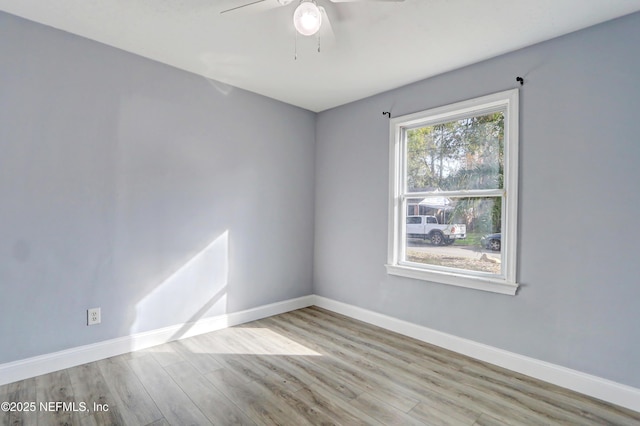 unfurnished room with ceiling fan and light hardwood / wood-style floors