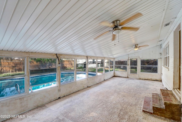 unfurnished sunroom with lofted ceiling