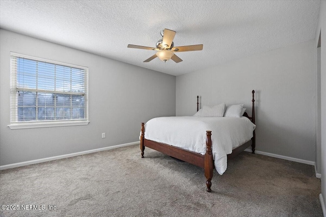 carpeted bedroom featuring a textured ceiling and ceiling fan