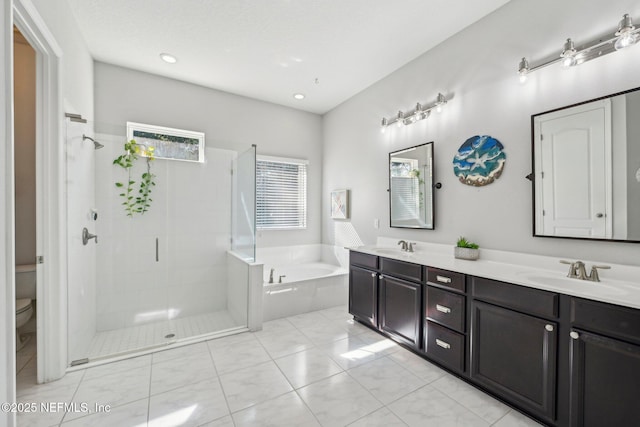 full bathroom featuring vanity, toilet, tile patterned flooring, and plus walk in shower