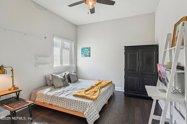 bedroom featuring dark wood-type flooring and ceiling fan