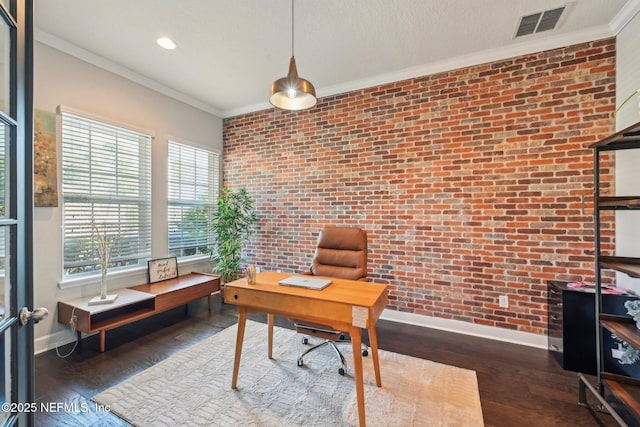 office with crown molding, brick wall, and dark hardwood / wood-style flooring