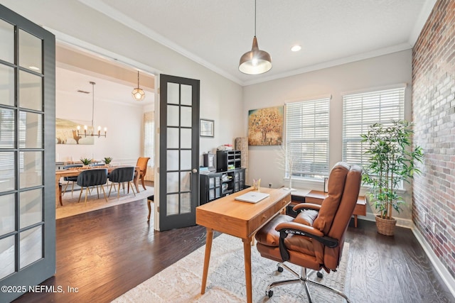 home office with crown molding, brick wall, dark hardwood / wood-style flooring, and french doors