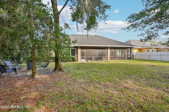 view of yard with a sunroom